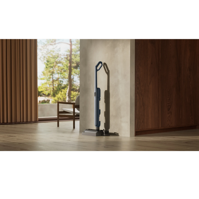 Vacuum cleaner in use in a home environment