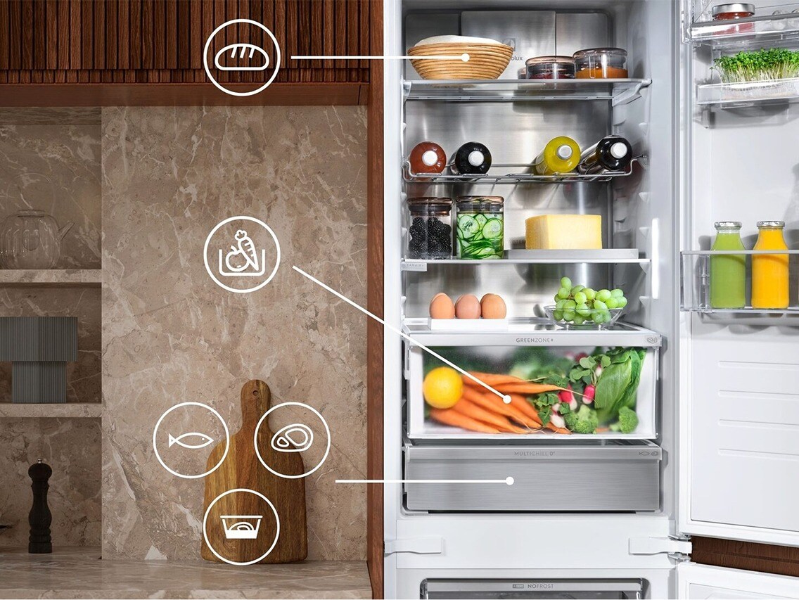 An open fridge freezer with different symbols displaying all of its features.