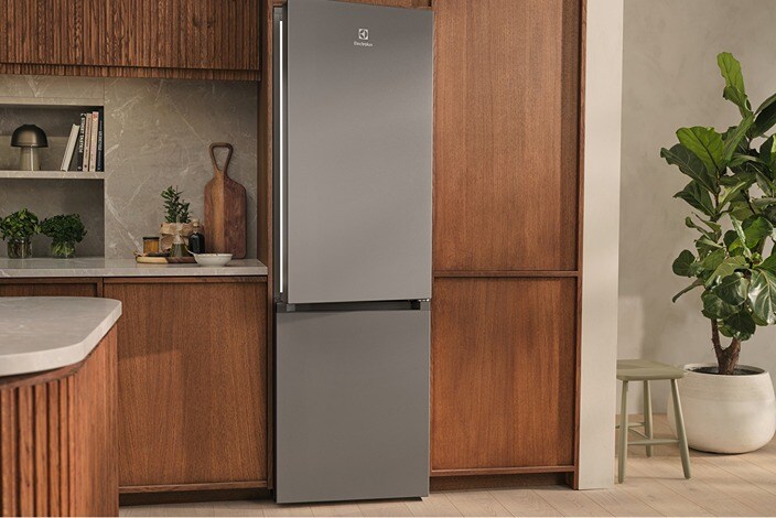 A freestanding fridge-freezer in a modern kitchen.