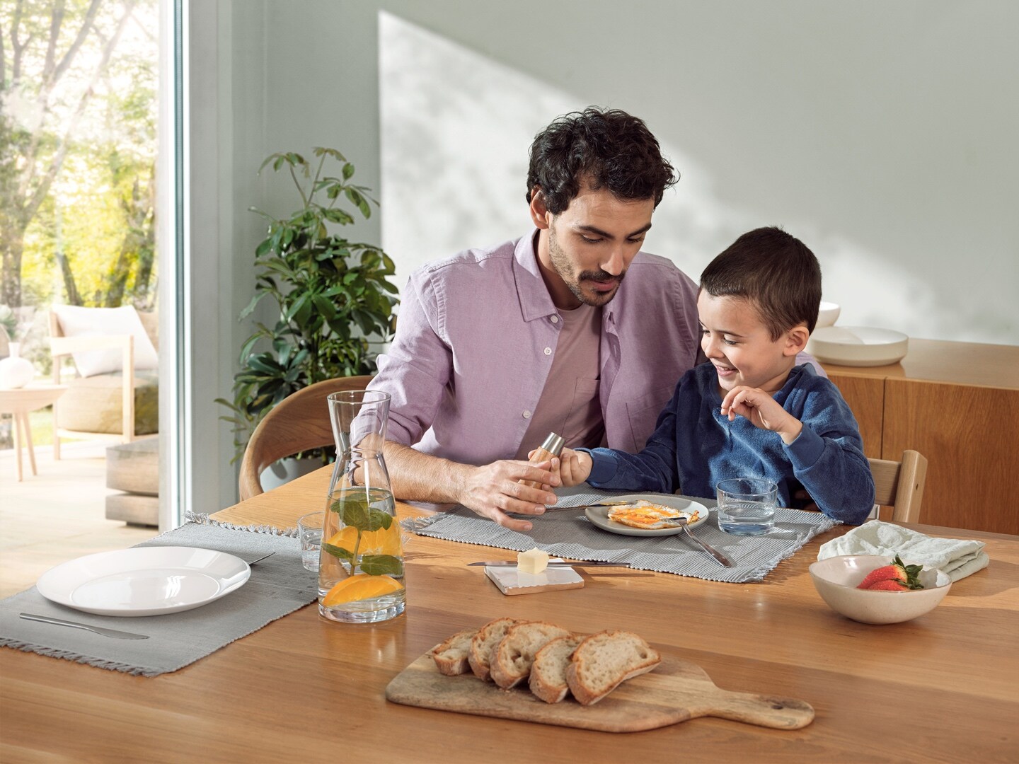 Father and son having breakfast