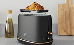 Toaster with a croissant on top