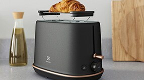 Toaster with a croissant on top